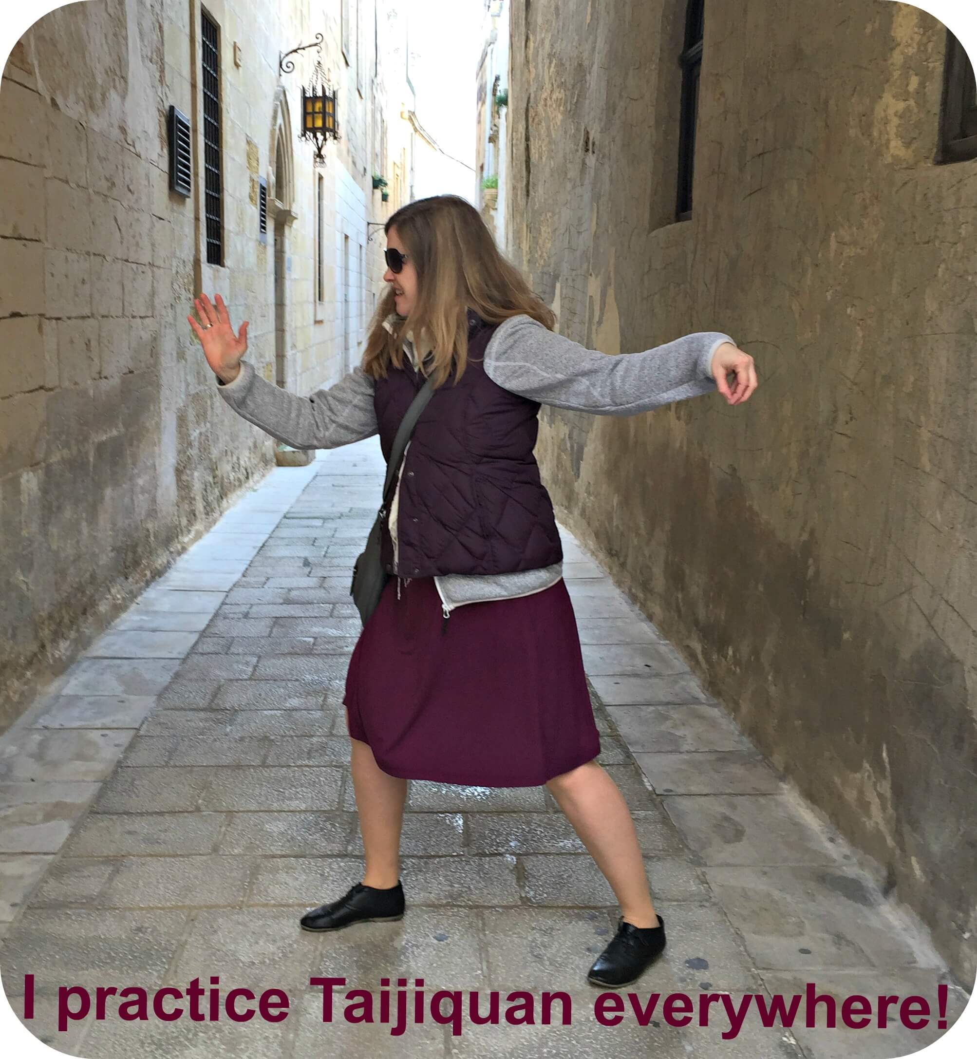 Angelika (blogger at Qialance) practices Taijiquan in old street of Mdina (Malta)