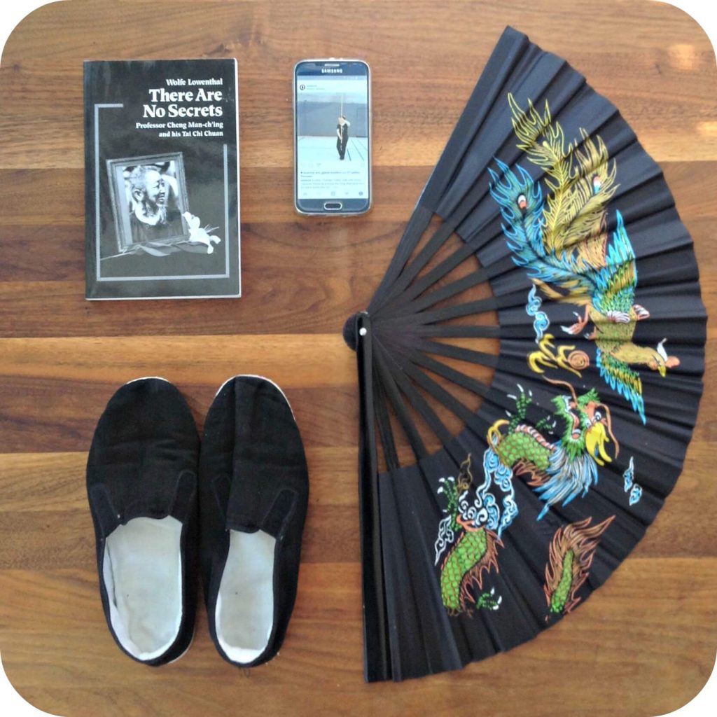 Picture of what one might need to preserve the art of Taijiquan: shoes, weapons, books, technology
