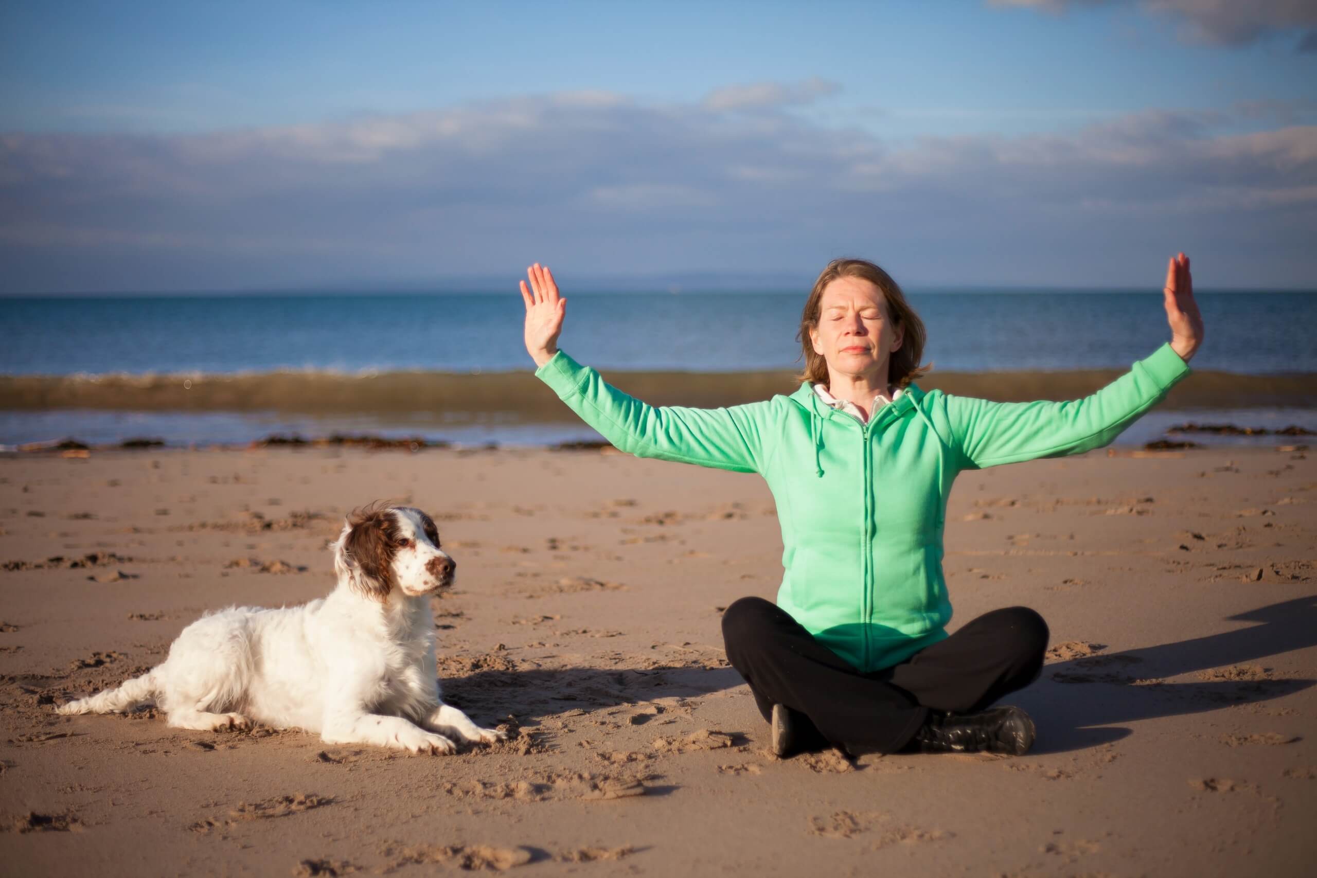 Janice Tucker from Space to Relax practicing Qi Gong at the beach